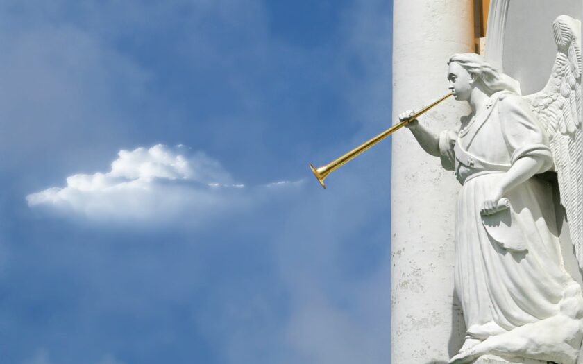 horning angel statuette